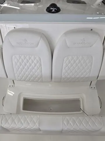 Slide: The Image of 2025 Regulator 26XO boat seats with quilted white upholstery. - 11