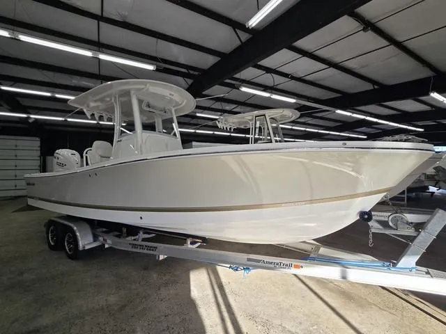 Slide: The Image of 2025 Regulator 26XO boat on trailer in indoor storage facility. - 3