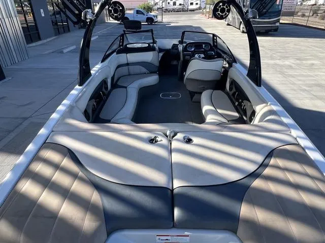 Slide: The Image of 2009 Malibu Wakesetter 23 LSV interior with spacious seating and modern design. - 10