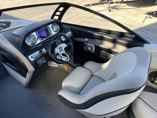 Slide: The Image of 2009 Malibu Wakesetter 23 LSV cockpit with modern dashboard and comfortable seating. - 14