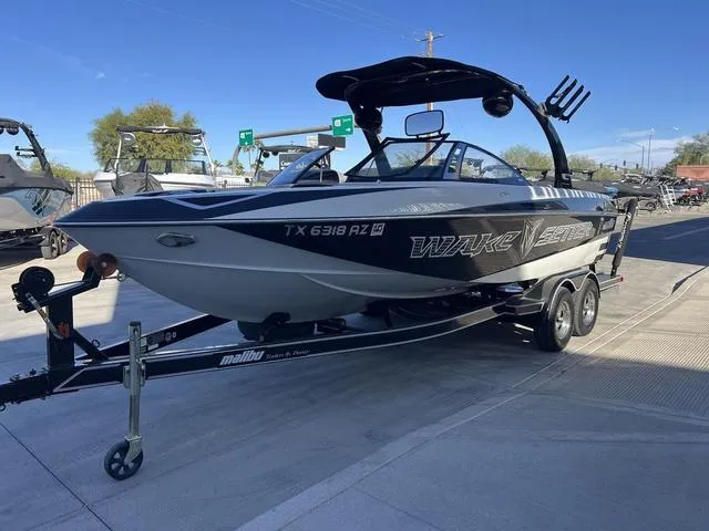 Slide: The Image of 2009 Malibu Wakesetter 23 LSV boat on trailer, parked outdoors. - 5