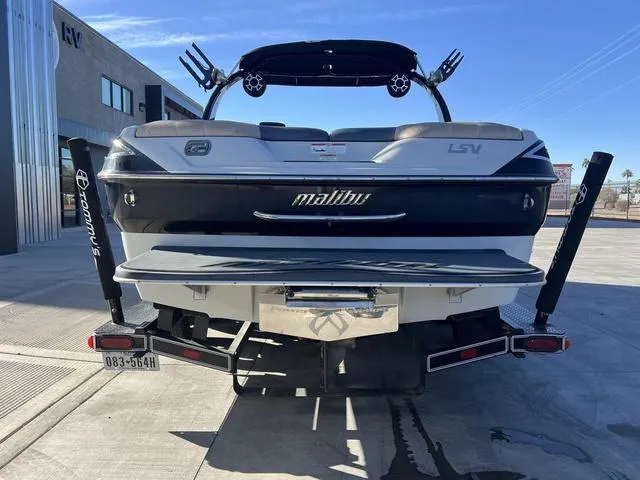 Slide: The Image of 2009 Malibu Wakesetter 23 LSV boat rear view in a parking lot. - 7