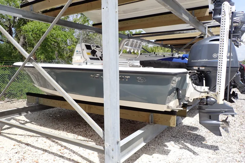 Slide: The Image of 2022 Key West 188 Bay Reef boat stored on a rack outdoors. - 1