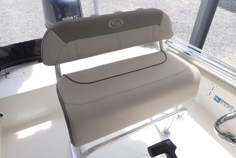 Slide: The Image of 2022 Key West 188 Bay Reef boat seat with beige upholstery and metal frame. - 16