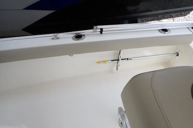 Slide: The Image of 2022 Key West 188 Bay Reef boat interior with rod holder and seating. - 19