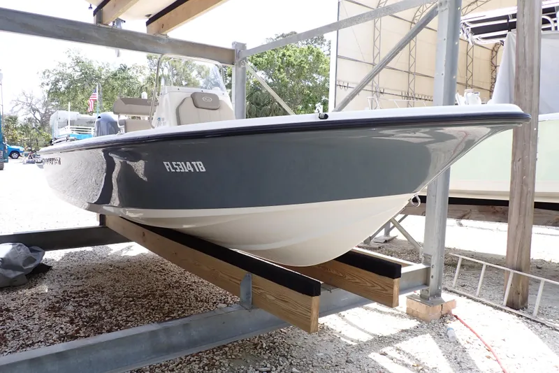 Slide: The Image of 2022 Key West 188 Bay Reef boat on a storage rack, side view. - 2
