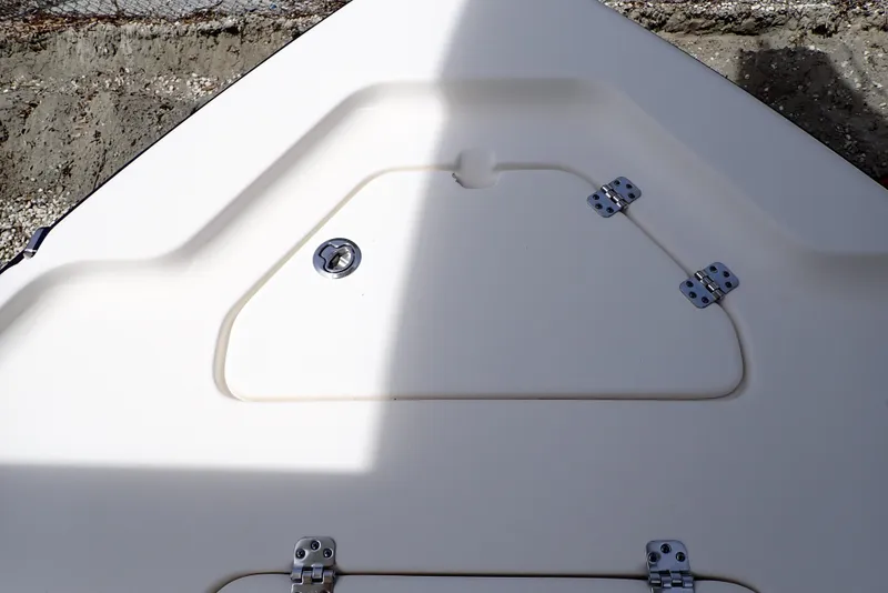 Slide: The Image of 2022 Key West 188 Bay Reef boat deck with storage compartment and hinges. - 20