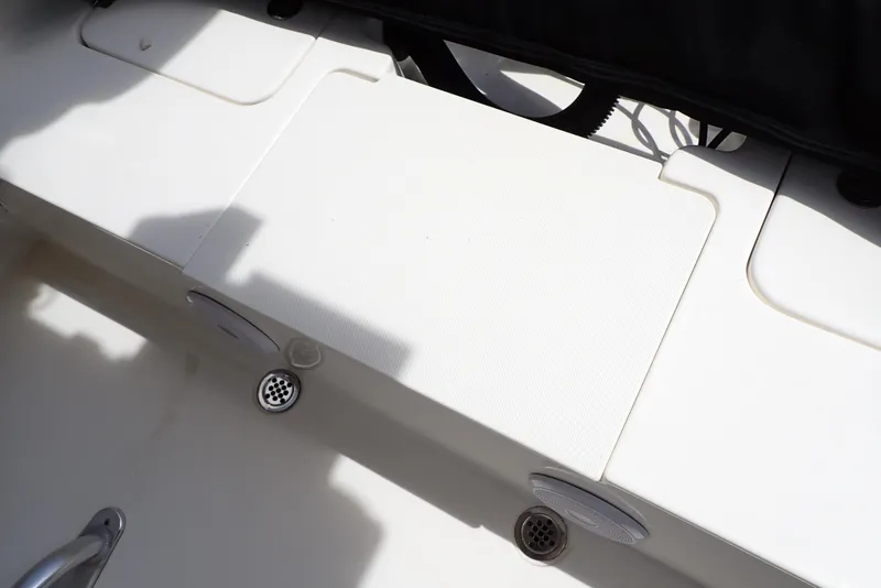 Slide: The Image of 2022 Key West 188 Bay Reef boat deck with storage compartments. - 30