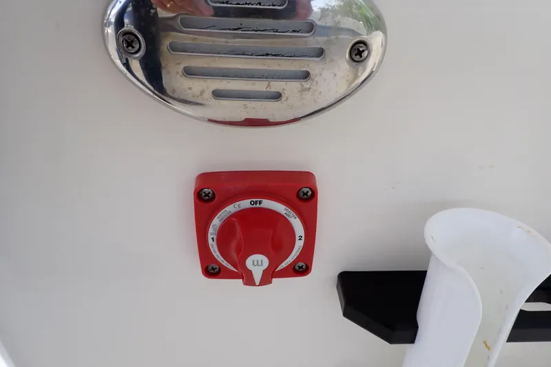 Slide: The Image of Red switch on 2022 Key West 188 Bay Reef boat control panel. - 37