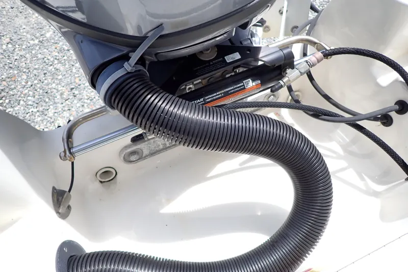 Slide: The Image of 2022 Key West 188 Bay Reef boat engine compartment with hoses and cables. - 38