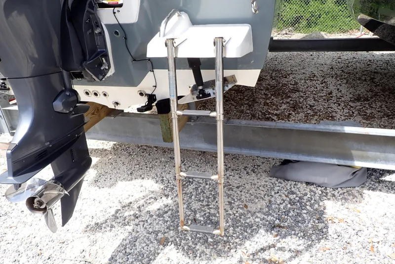 Slide: The Image of 2022 Key West 188 Bay Reef boat with ladder and outboard motor. - 39