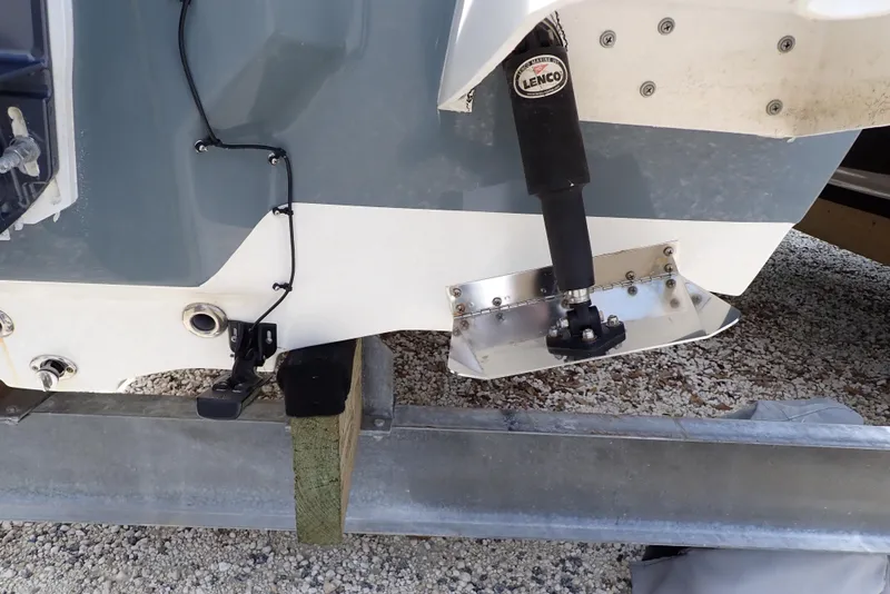 Slide: The Image of 2022 Key West 188 Bay Reef boat on trailer, showing trim tab and hull details. - 43