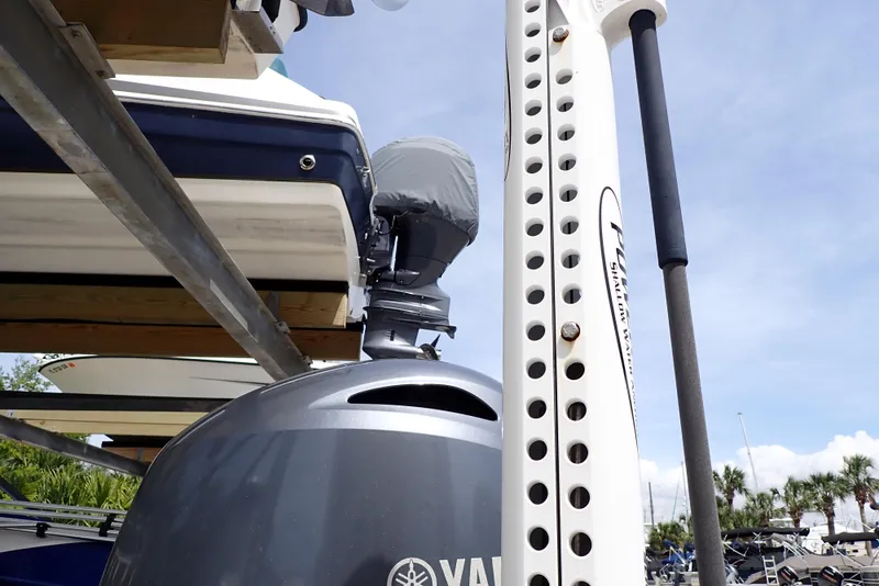 Slide: The Image of 2022 Key West 188 Bay Reef boat with Yamaha outboard motor, docked under clear sky. - 44