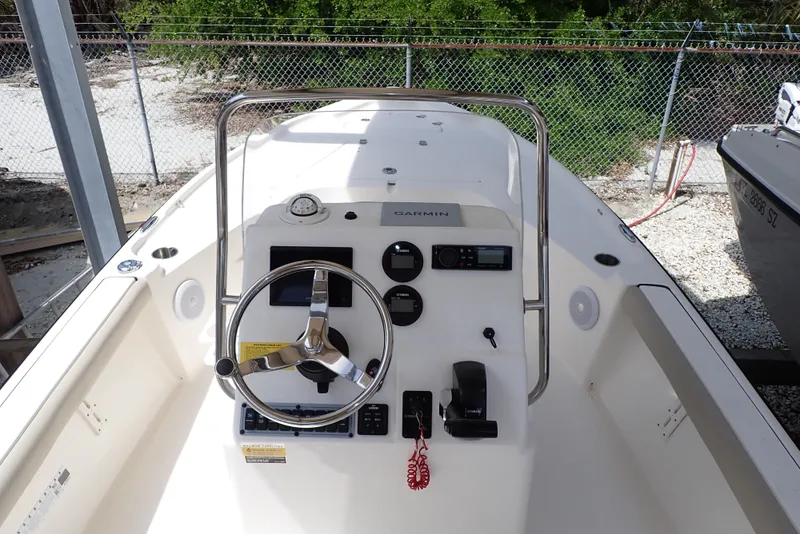 Slide: The Image of 2022 Key West 188 Bay Reef boat console with steering wheel and controls. - 5