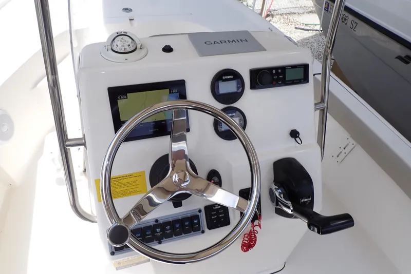 Slide: The Image of 2022 Key West 188 Bay Reef boat console with Garmin navigation system and steering wheel. - 9