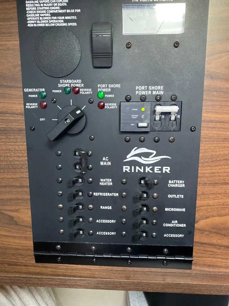 Slide: The Image of Control panel of a 2018 Rinker EX 270 boat with various switches and indicators. - 17