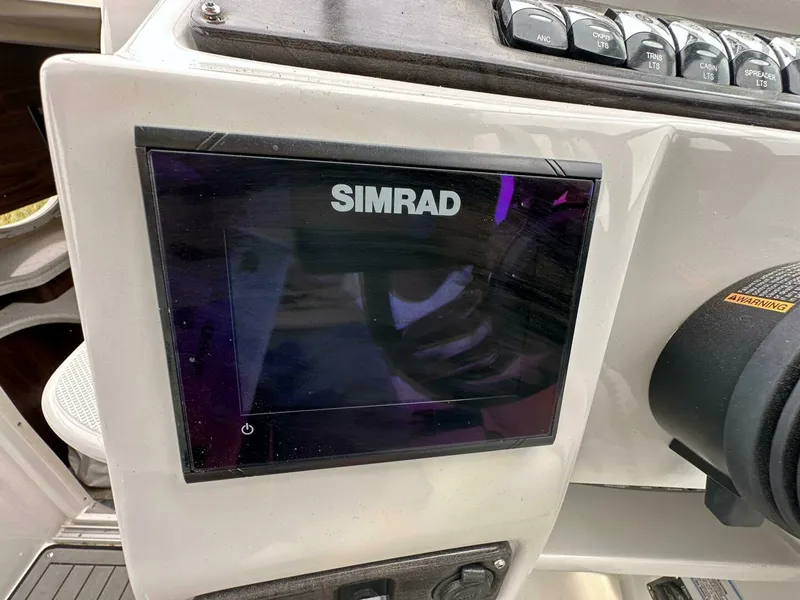 Slide: The Image of Simrad display on 2018 Rinker EX 270 boat dashboard. - 6
