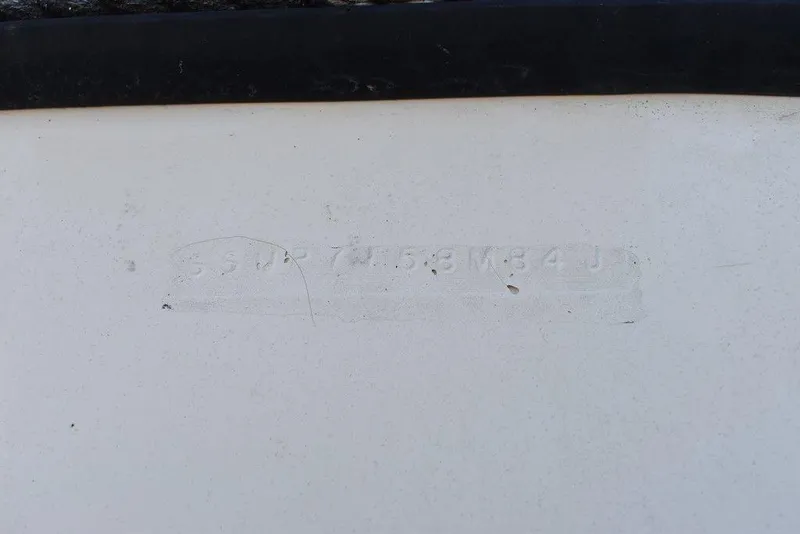 Slide: The Image of Faded hull identification number on 1984 Tiara Sport 2700 boat. - 42