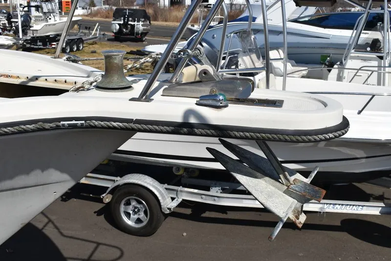Slide: The Image of 1984 Tiara Sport 2700 boat with anchor, docked on trailer. - 5