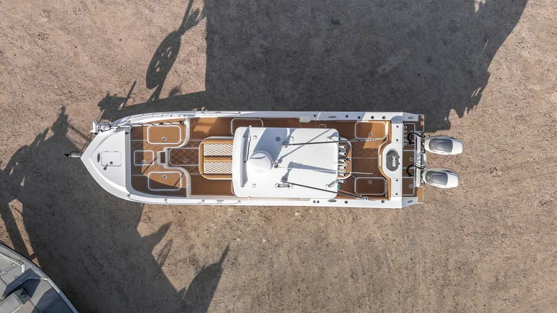 Slide: The Image of Aerial view of 2019 Shallow Sport 32 X3 boat on dry land, showcasing deck layout. - 3