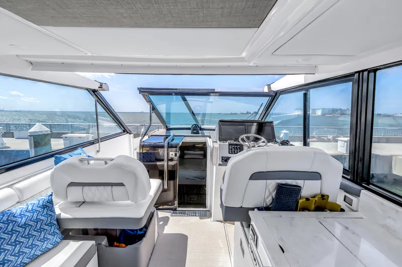 Slide: The Image of Luxurious interior of 2022 Regal 36 XO yacht with modern helm and seating. - 12