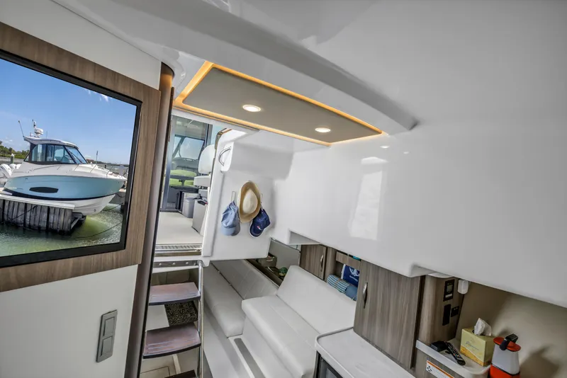 Slide: The Image of 2022 Regal 36 XO yacht interior with modern design and natural light. - 30