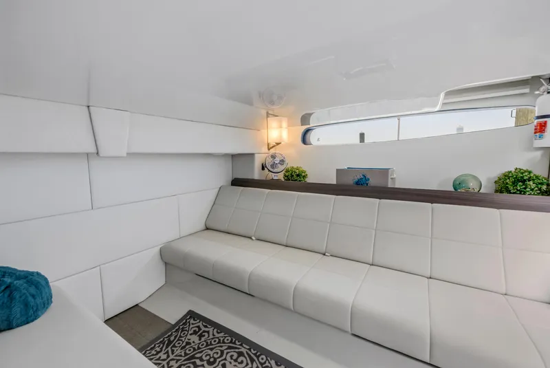 Slide: The Image of Luxurious interior of 2022 Regal 36 XO yacht with white seating and modern decor. - 34