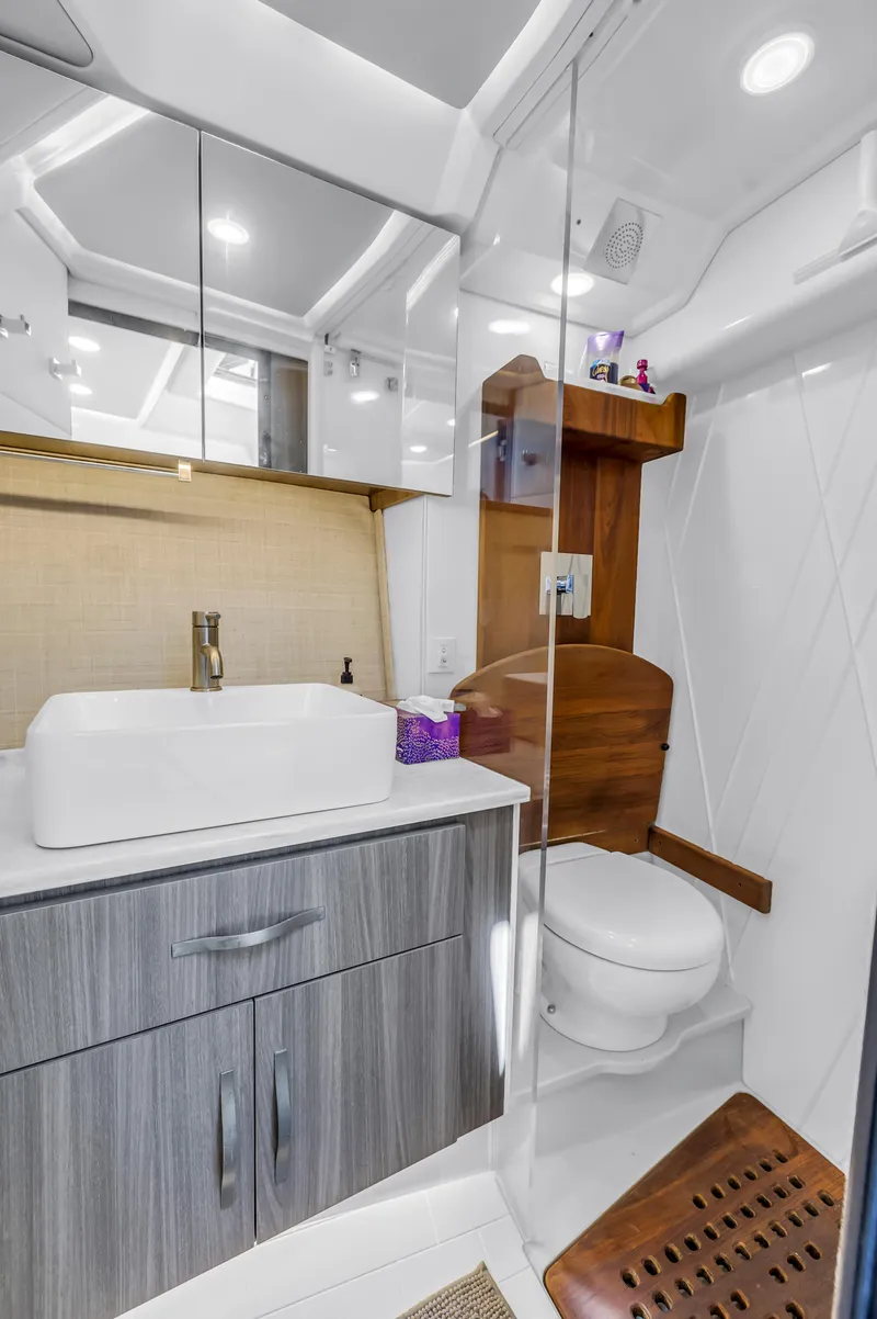 Slide: The Image of Luxurious bathroom in 2022 Regal 36 XO yacht with modern fixtures and elegant design. - 36