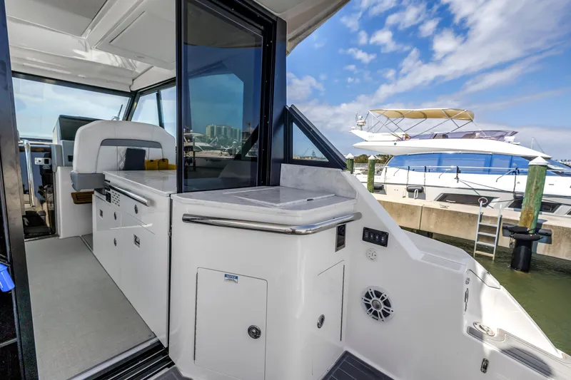 Slide: The Image of 2022 Regal 36 XO yacht interior with sleek design and modern amenities. - 40