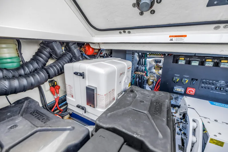 Slide: The Image of Engine room of 2022 Regal 36 XO boat, showcasing electrical components and wiring. - 41