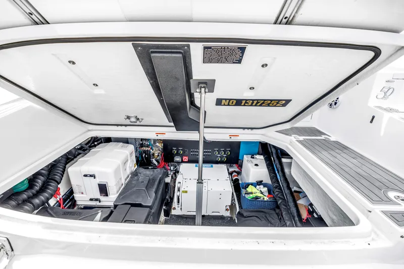 Slide: The Image of Engine compartment of 2022 Regal 36 XO boat, showcasing equipment and storage. - 42