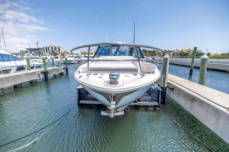 Slide: The Image of 2022 Regal 36 XO boat docked in marina, front view. - 5