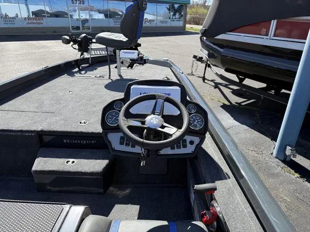 Slide: The Image of 2025 Ranger RT198P boat interior with steering wheel and dashboard controls. - 4