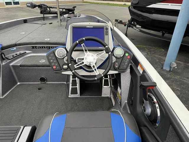 Slide: The Image of 2017 Ranger Z520C boat cockpit with steering wheel and navigation system. - 4