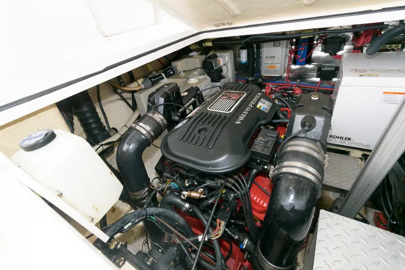 Slide: The Image of Engine compartment of 2007 Regal 3360 Window Express boat, featuring Volvo Penta engine. - 19