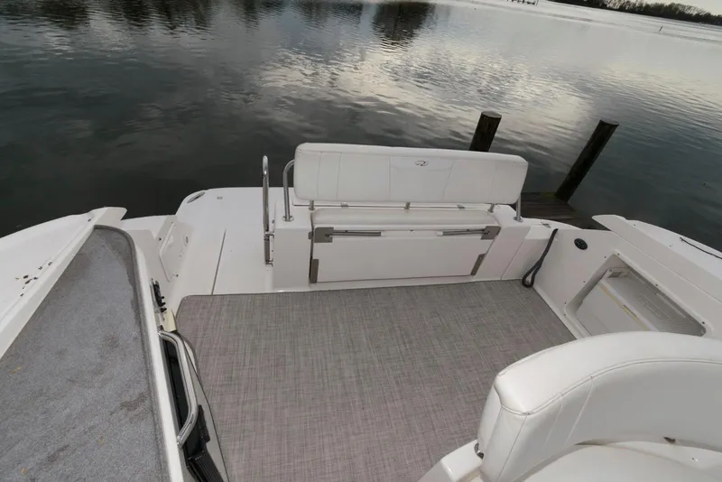 Slide: The Image of 2007 Regal 3360 Window Express boat deck with seating, overlooking calm water. - 4