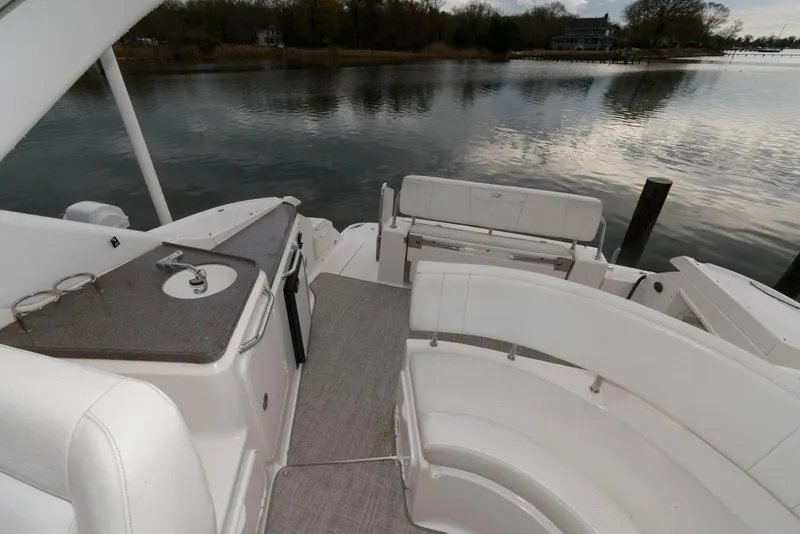 Slide: The Image of 2007 Regal 3360 Window Express boat interior with seating and water view. - 5