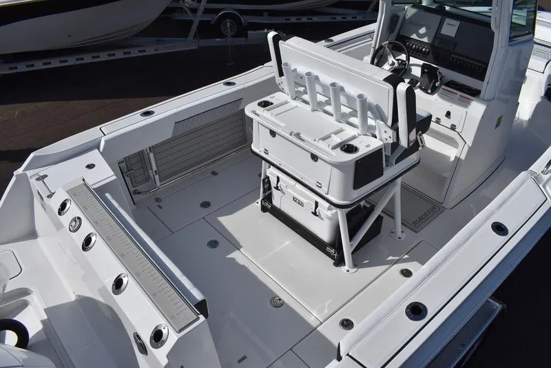 Slide: The Image of 2025 Blackfin 252CC boat interior with seating and console, showcasing modern design and functionality. - 10