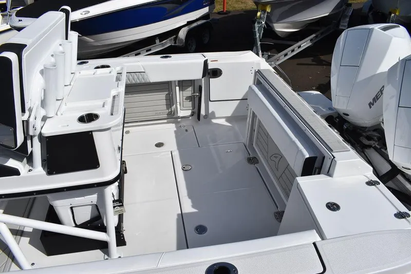 Slide: The Image of 2025 Blackfin 252CC boat interior with spacious deck and modern amenities. - 14