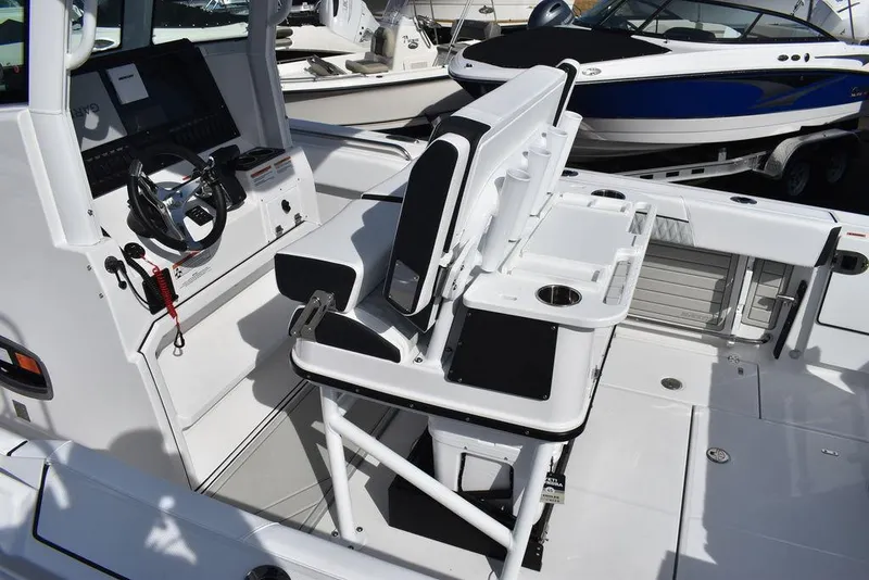 Slide: The Image of 2025 Blackfin 252CC boat interior with modern helm and seating. - 15