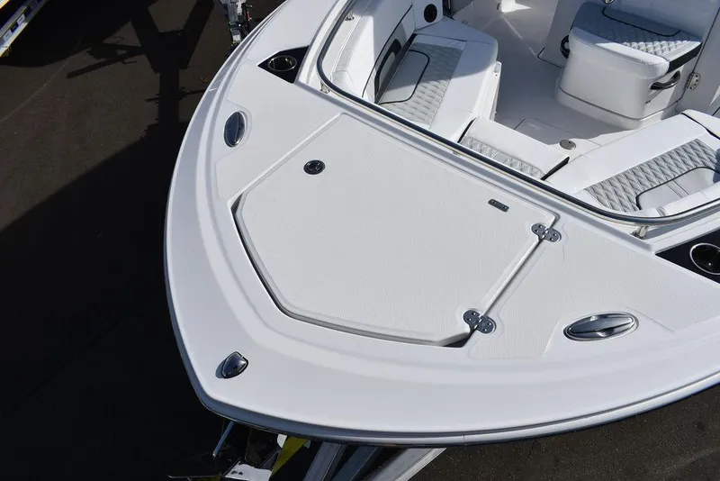 Slide: The Image of 2025 Blackfin 252CC boat deck with sleek white design and seating area. - 20
