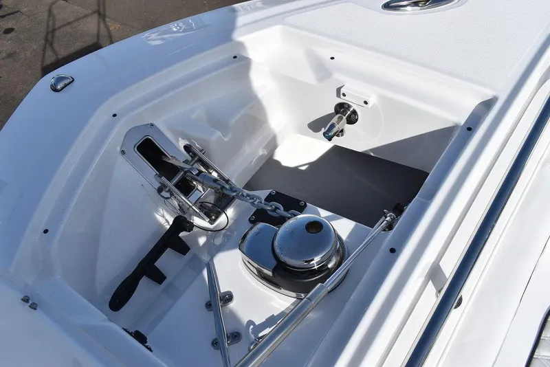 Slide: The Image of 2025 Blackfin 252CC boat anchor compartment with winch and cleat. - 23