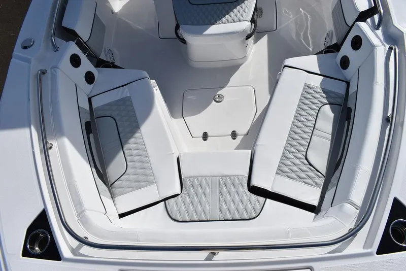 Slide: The Image of 2025 Blackfin 252CC boat interior with cushioned seating and modern design. - 24