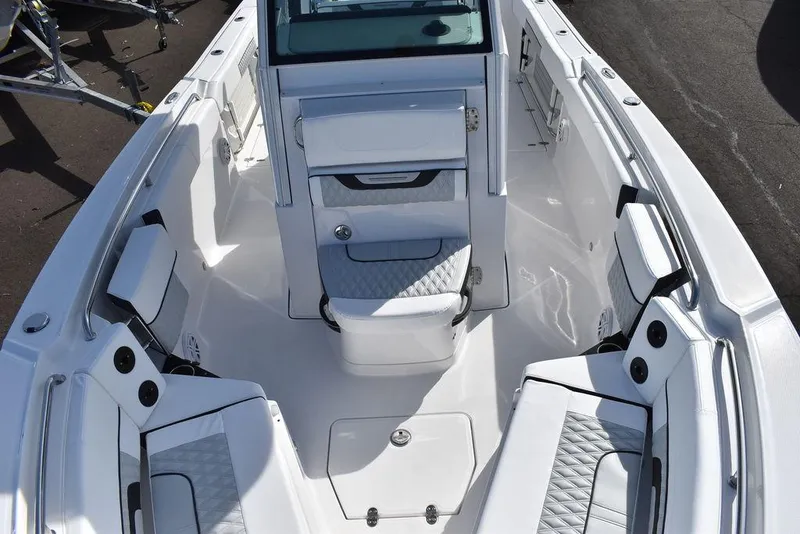 Slide: The Image of 2025 Blackfin 252CC boat interior with white seating and modern design. - 25