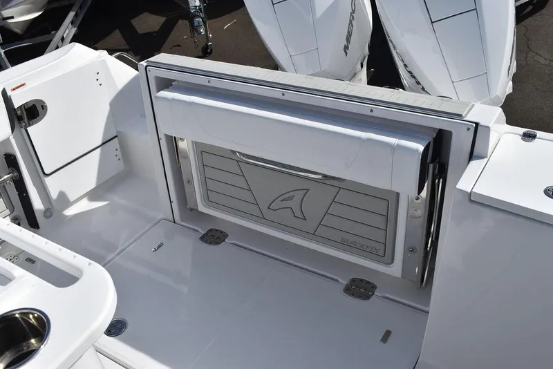 Slide: The Image of 2025 Blackfin 252CC boat interior with sleek white design and modern features. - 26