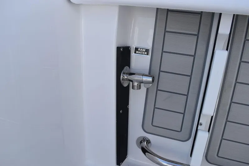 Slide: The Image of 2025 Blackfin 252CC raw water outlet with sleek design and modern fittings. - 31