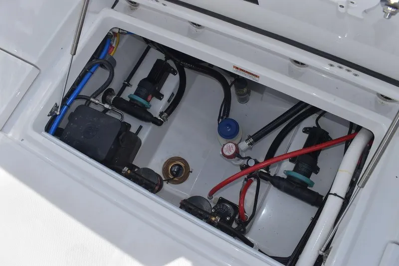 Slide: The Image of 2025 Blackfin 252CC boat compartment with wiring and components. - 33