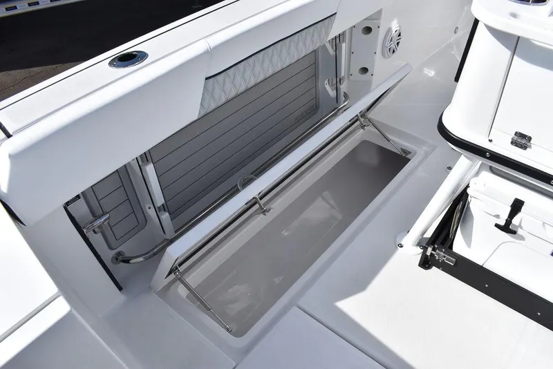 Slide: The Image of 2025 Blackfin 252CC boat interior with open storage compartment and sleek design. - 35