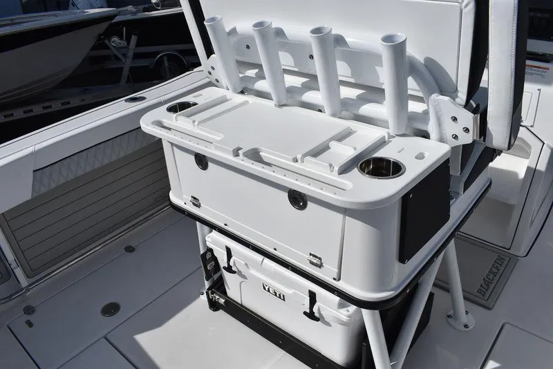 Slide: The Image of 2025 Blackfin 252CC boat with rod holders and storage compartments on deck. - 36