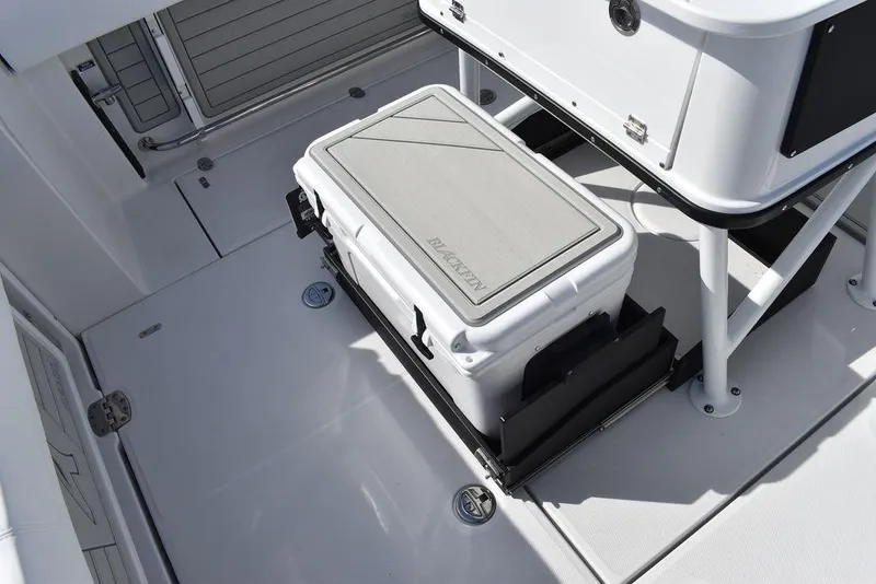 Slide: The Image of 2025 Blackfin 252CC boat interior with cooler storage area. - 38